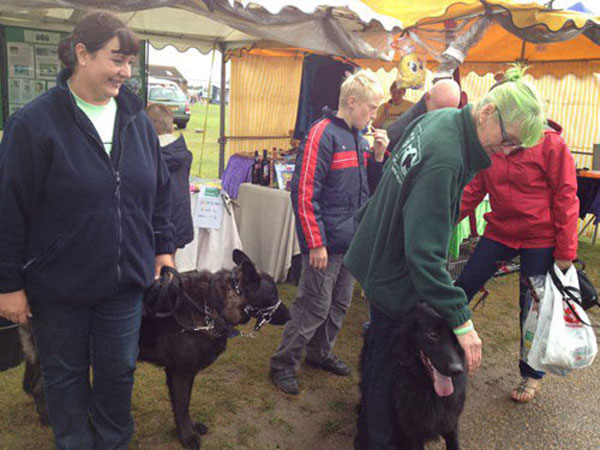 volunteers manning the merchandise stand