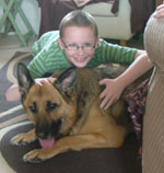 young lad with his gsd