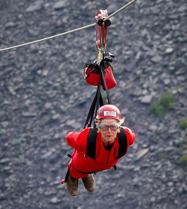 volunteer looking worried on the zipwire