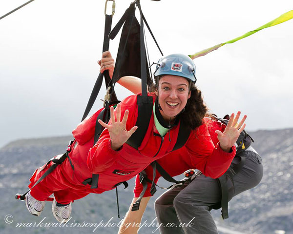 carla volunteer completing the zip wire