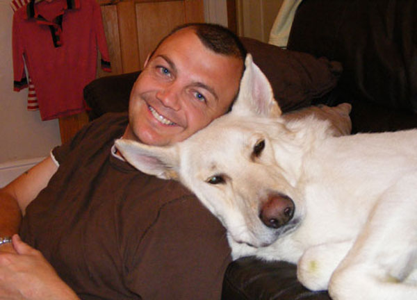 ice the white gsd snoozing with his dad