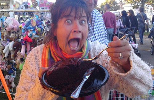lisa eating a big chocolate cake