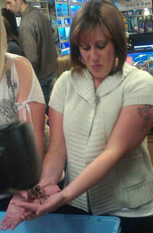 kirsty holding the tarantula to raise money for the rescue